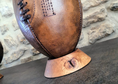 Wooden tee for old rugby ball