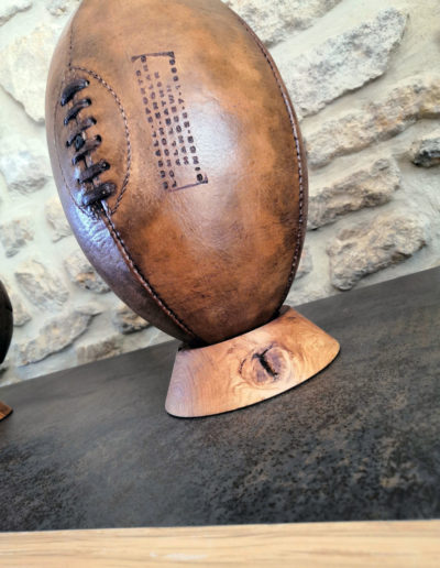 Wooden tee for old rugby ball