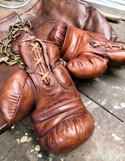 Antique John Woodbridge boxing gloves brought to our workshop for polishing