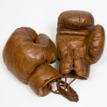 Vintage boxing gloves on white background