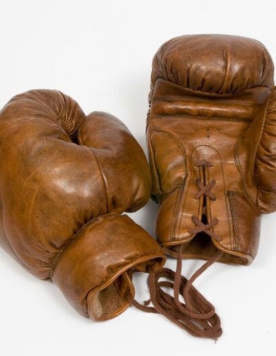 Vintage boxing gloves on white background