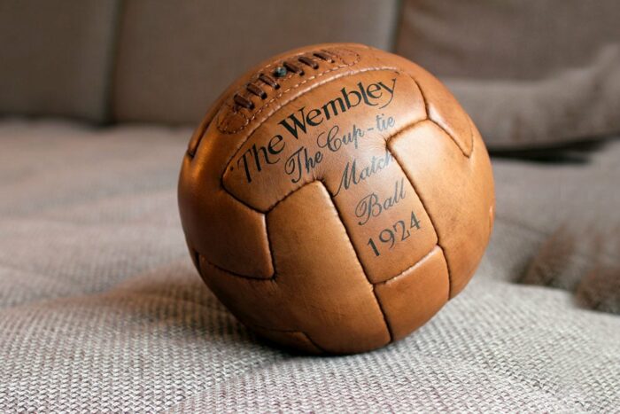 Presentation of an old football on the sofa