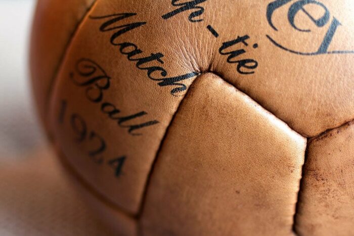 The seams of the 12 panels of a vintage soccer ball