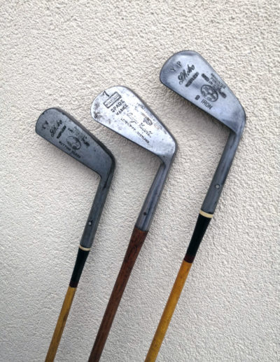 3 old but renovated golf irons with shiny heads