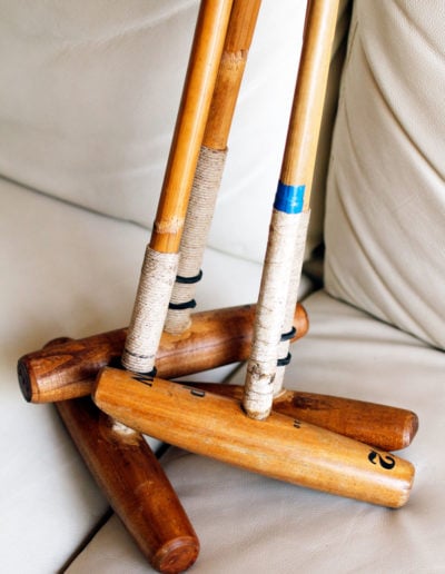 Old polo mallet in a set on his sofa