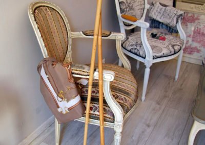 A pair of polo mallets in a room with English decor