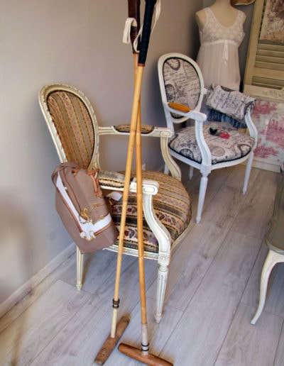 A pair of polo mallets in a room with English decor