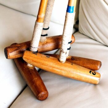 Old polo mallet in a set on a sofa