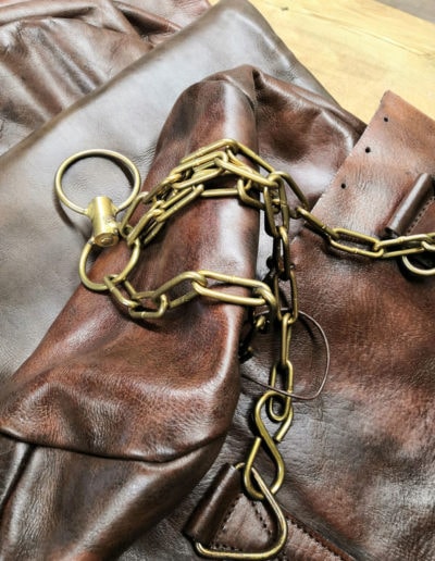 Old boxing bag with brass chains