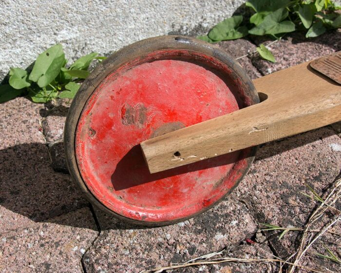 A wooden scooter wheel