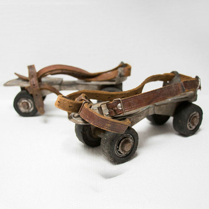 old roller skates with leather straps