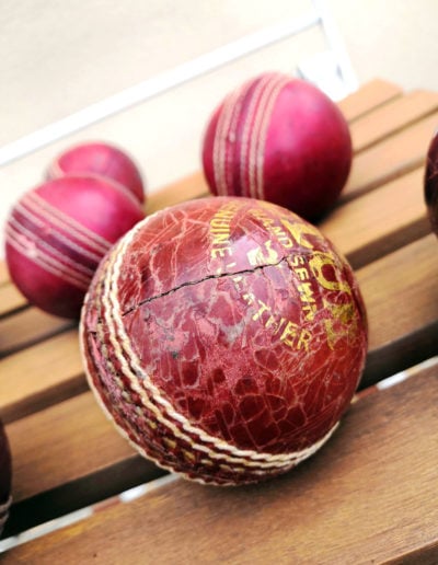 A macro view of a cracked cricket ball