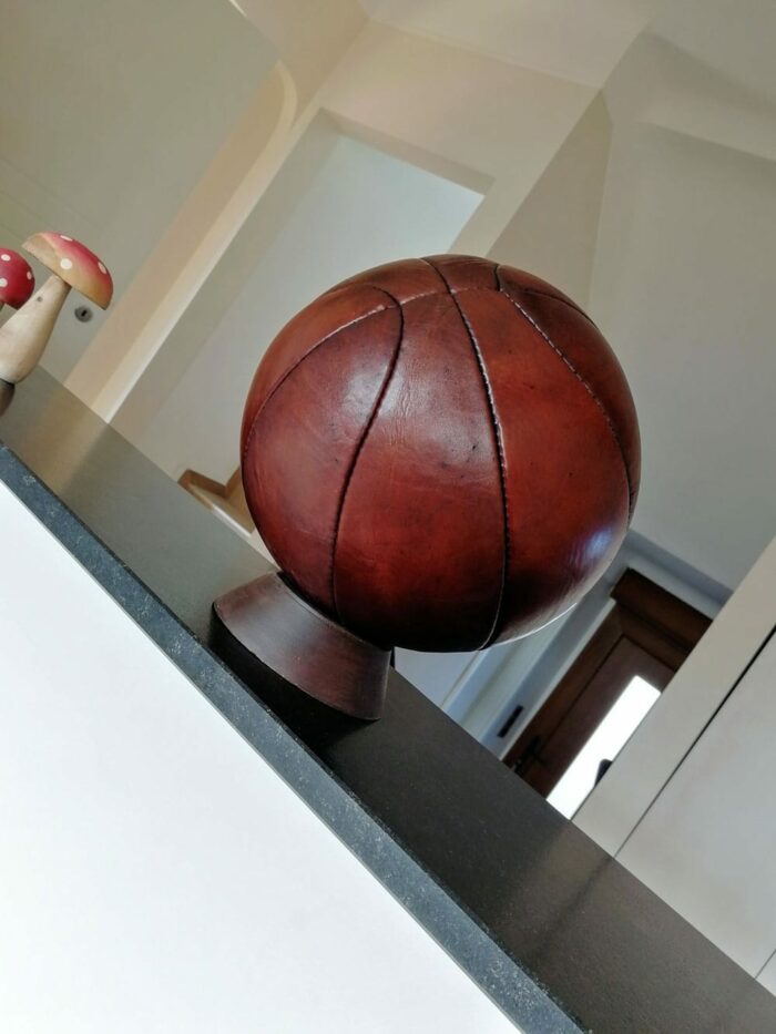 Presentation of the basketball on a base at the entrance of the exhibition