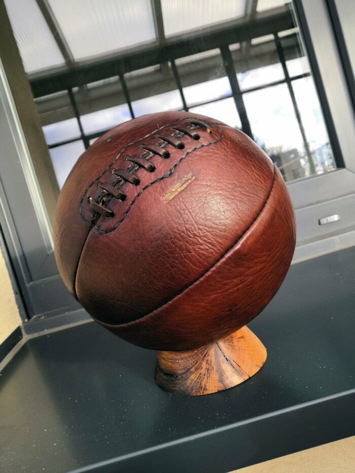 A vintage basketball on a windowsill