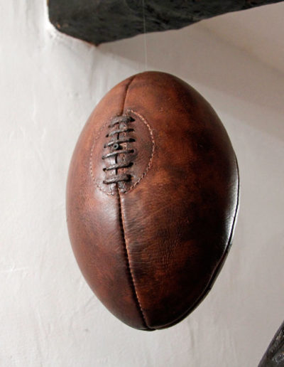 Presentation of the leather ball suspended in the air for a cheap decoration