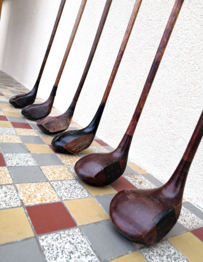 Head of old golf clubs on the ground