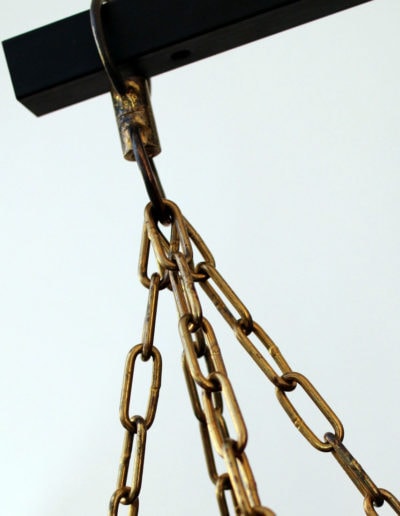 Macro view of the brass chains of a heavy bag