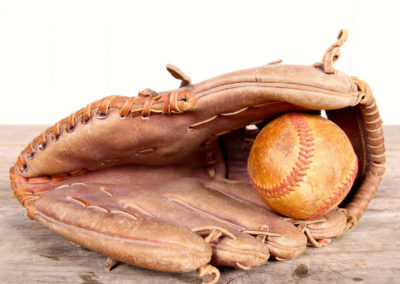 Vintage but discreet baseball glove with its game ball