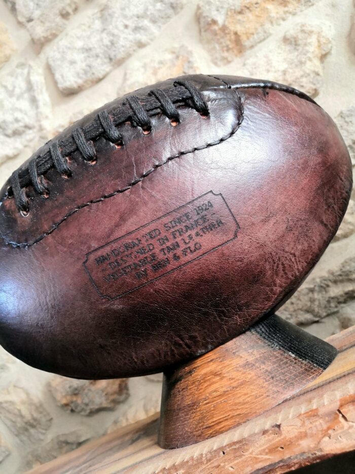 Ben and Flo stamp on a leather US football