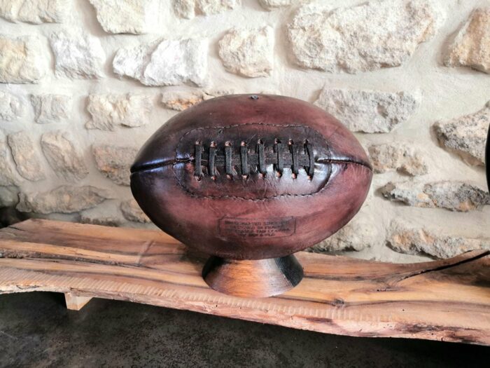 A US football presented on a base