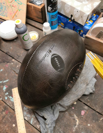 Logo engraving on a rugby ball