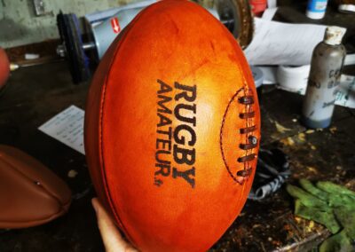 Ballon de rugby ancien orange avec le logo Rugby Amateur fr